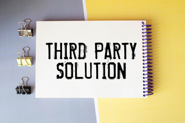 Closeup on businessman holding a card with THIRD PARTY SOLUTION message