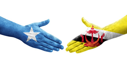 Handshake between Brunei and Somalia flags painted on hands, isolated transparent image.