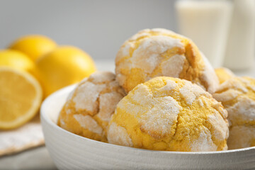 Delicious lemon cookies in bowl on table, closeup