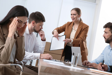 Boss screaming at employees in office. Toxic work environment