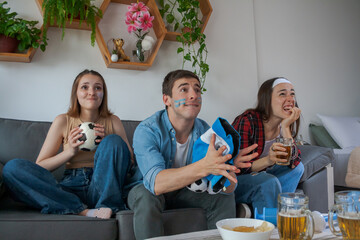 friends watching soccer in frustration and despair