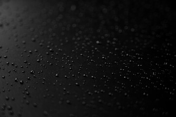 Water droplets on the floor with black background