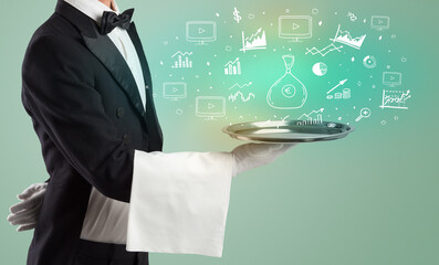Handsome young waiter in tuxedo holding money icons on tray