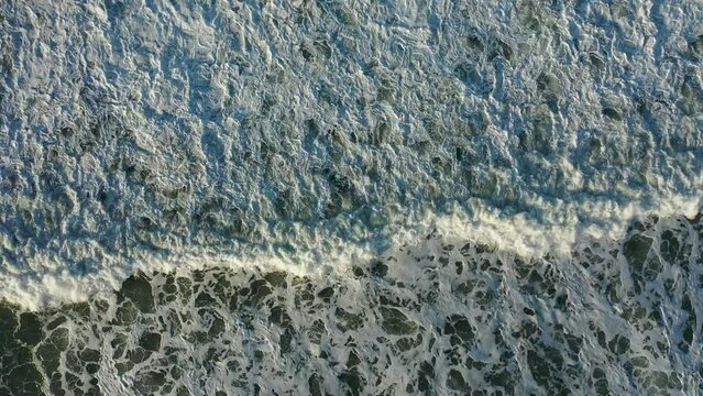 Dramatic Sea Texture 4K filmed on a drone in the sunset