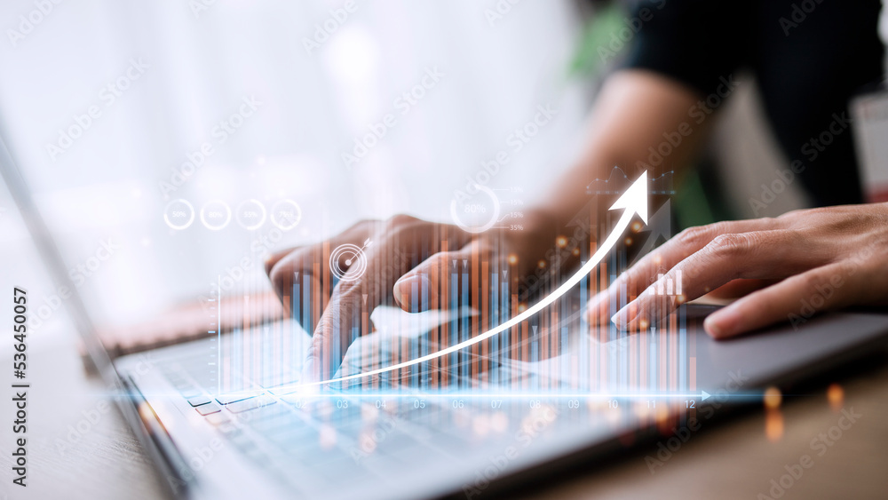 Poster people using tablets and using his finger to touch the screen with a business graph showing up in a 
