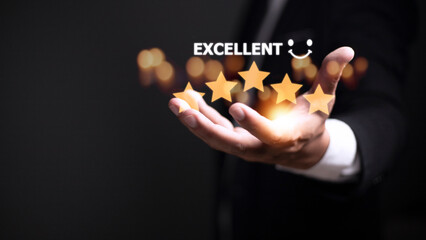 customer hand  with gold five star rating feedback icon and press level excellent rank for giving best score point to review the service, business concept