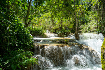 Fototapeta na wymiar Kuang Si Waterfall, the most beautiful waterfall in Laos