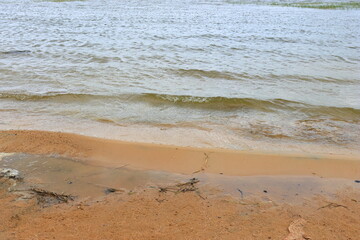 Transparent clear water on the sand beach