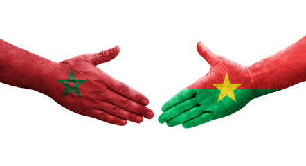 Handshake between Burkina Faso and Morocco flags painted on hands, isolated transparent image.