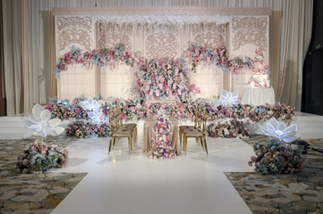 Wedding decoration with multi colors flowers and modern design table setting. Intimacy wedding ceremony or party indoors. 