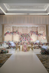 Wedding decoration with multi colors flowers and modern design table setting. Intimacy wedding ceremony or party indoors. 