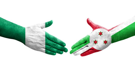 Handshake between Burundi and Nigeria flags painted on hands, isolated transparent image.