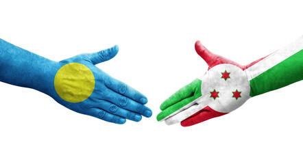 Handshake between Burundi and Palau flags painted on hands, isolated transparent image.