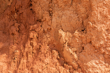 Close up of the dry and cracked clay background texture