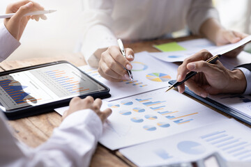 Financial Business successful teamwork diverse coworkers working together in boardroom, brainstorming, discussing growth report graph and analyzing and planning business strategy.