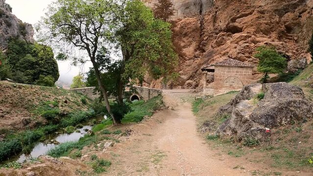 medieval bridge over Molinar river and Cristo de los Remedios hermitage at Tobera village, municipality of Fr&iacute;as, province of Burgos, Castile and Le&oacute;n, Spain