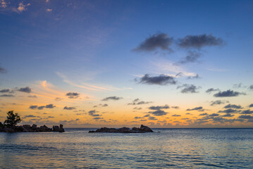 Sunset on the Petite Anse beach on the Praslin island in Seychelles