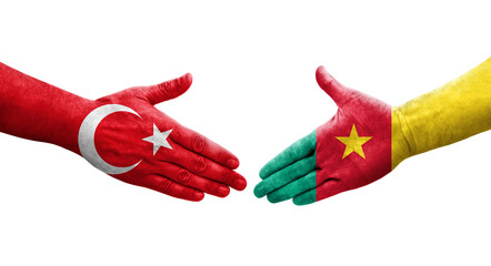 Handshake between Cameroon and Turkey flags painted on hands, isolated transparent image.