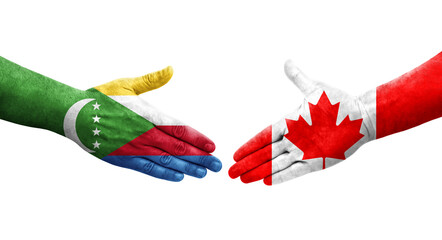 Handshake between Canada and Comoros flags painted on hands, isolated transparent image.