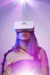Woman is using virtual reality headset. Concept of virtual, augmented and extended reality and metaverse.