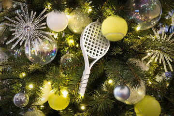 a tennis racket in the form of a toy for decorating a Christmas tree for the new year. Decorated...