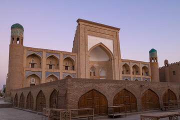 Ancient madrasah of Kutlug-Murad Inaka (1804-1812) on the early morning. Khiva, Uzbekistan