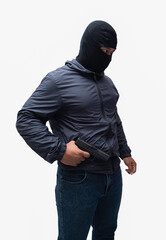 Burglar or terrorist. Holding pistol in various poses on background isolated with clipping path.