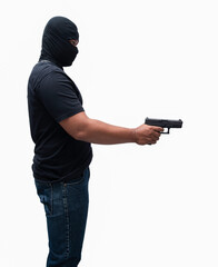Burglar or terrorist. Holding pistol in various poses on background isolated with clipping path.