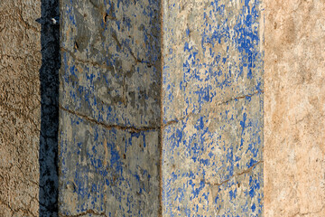 faded and decrepit wall in Olhao, algarve, portugal