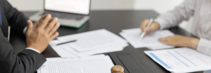 Lawyer or judge has recommend a client sign a legal agreement in the courtroom, Legal Agreement...