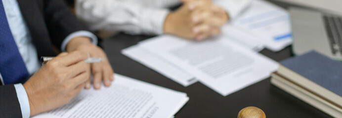 Lawyers or judges sign documents in accordance with legal and fair terms of agreement, Legal Ethics and Integrity, scales of justice, law hammer, Litigation and legal services.