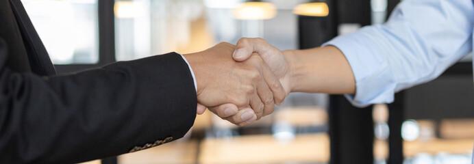 Businessman shaking hands with a lawyer or judge After signing the contract and the agreement is...