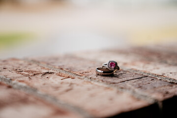 Wedding rings on brick wall