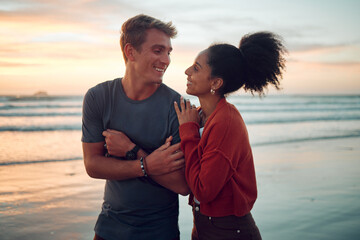 Summer, love and couple at a beach on vacation, bonding and laughing while walking along the sea at...