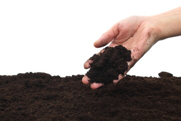 Earth is pouring out of a woman's hand.
