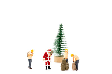 Miniature people Worker and Santa Claus carrying bag on white background