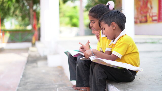 Cute Indian Little Child Studying At Home. Indian Kid Studying