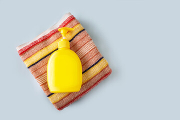 striped terry towel and liquid soap bottle, copy space, mock-up