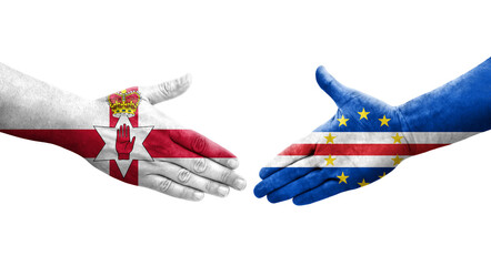 Handshake between Cape Verde and Northern Ireland flags painted on hands, isolated transparent image.