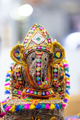 Lord Ganesh idol made of jute with blur background. Selective focus on lord ganesha.