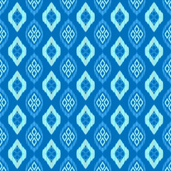 Ikat seamless pattern blue gradation color background. African mayan ethnic diamond shape line fabric seamless patterns. Design for textile, wallpaper, clothing, backdrop. Vector retro vintage style.