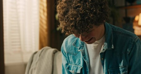 Lucky student who writes and sticks cards with English names of objects on things in the living room. The concept of studying for an exam.