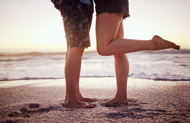 Love, romance and legs on beach, couple in sunset on summer holiday together. Ocean, man and woman...