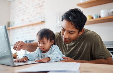 Father, down syndrome baby and laptop in the kitchen bonding with child while working at home. Asian dad playing with newborn kid with genetic disorder and helping childhood development in the house