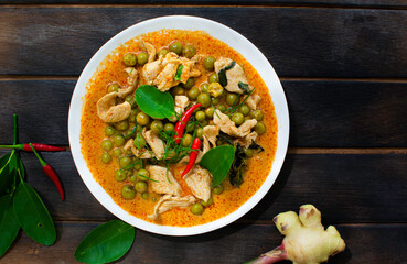 Panang Curry in a plate on a wooden floor