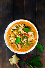 Panang Curry in a plate on a wooden floor