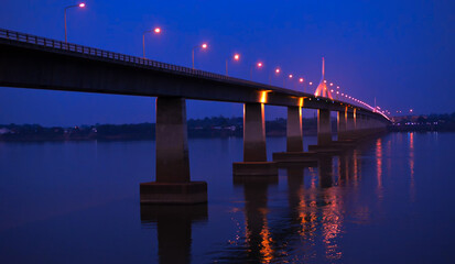 Fototapeta na wymiar Bridge over the Great River at night soft focus building