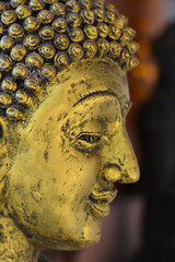 Golden Buddha head. Sacred things are worshiped by Buddhism.
