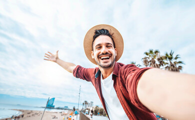 Handsome man taking selfie in Barcelona city, Spain  - obrazy, fototapety, plakaty