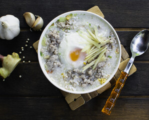 Porridge in a cup on the wooden floor